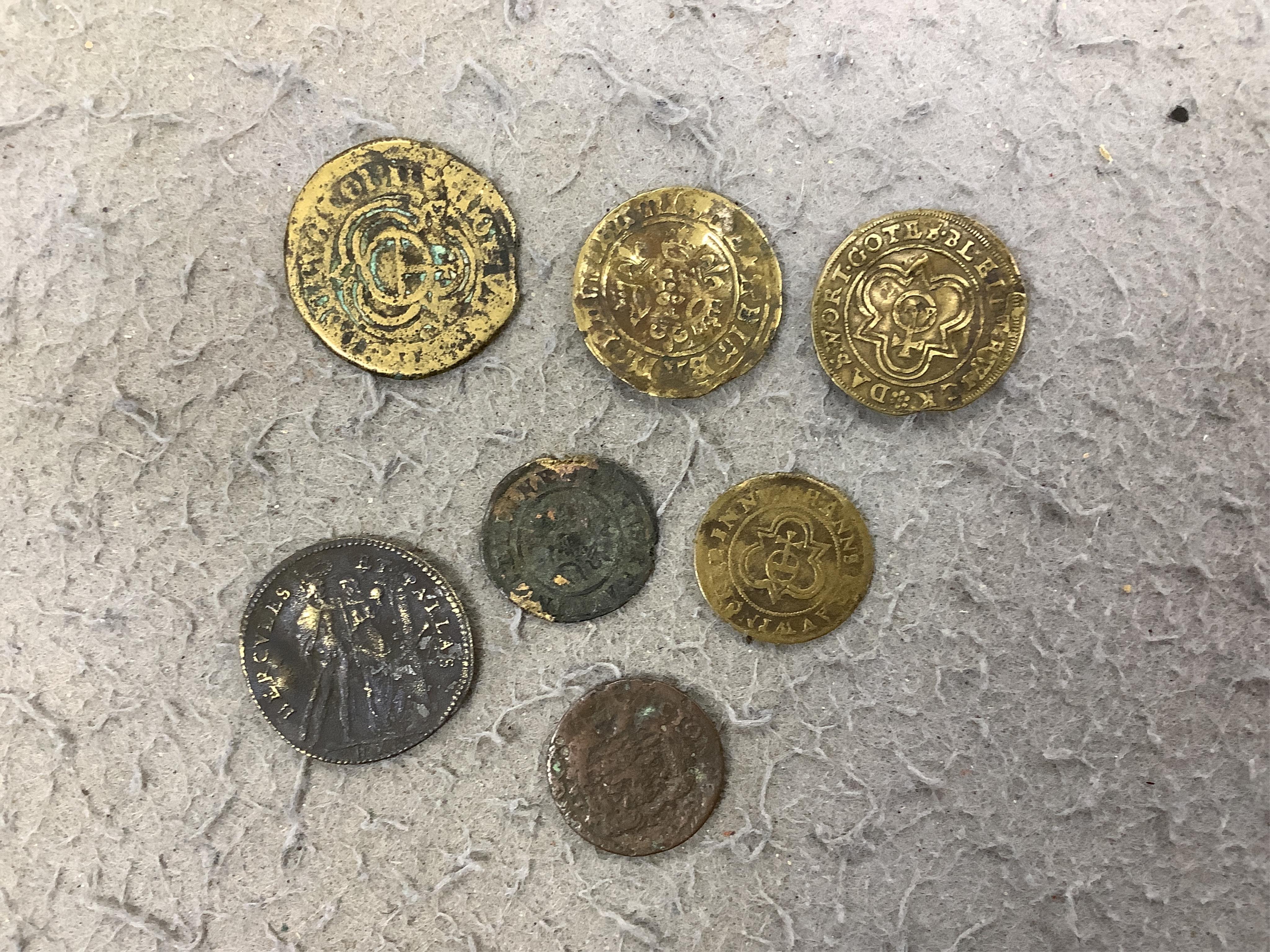 A large collection of halfpenny tokens and gaming tokens, 17th to early 20th century, in an album